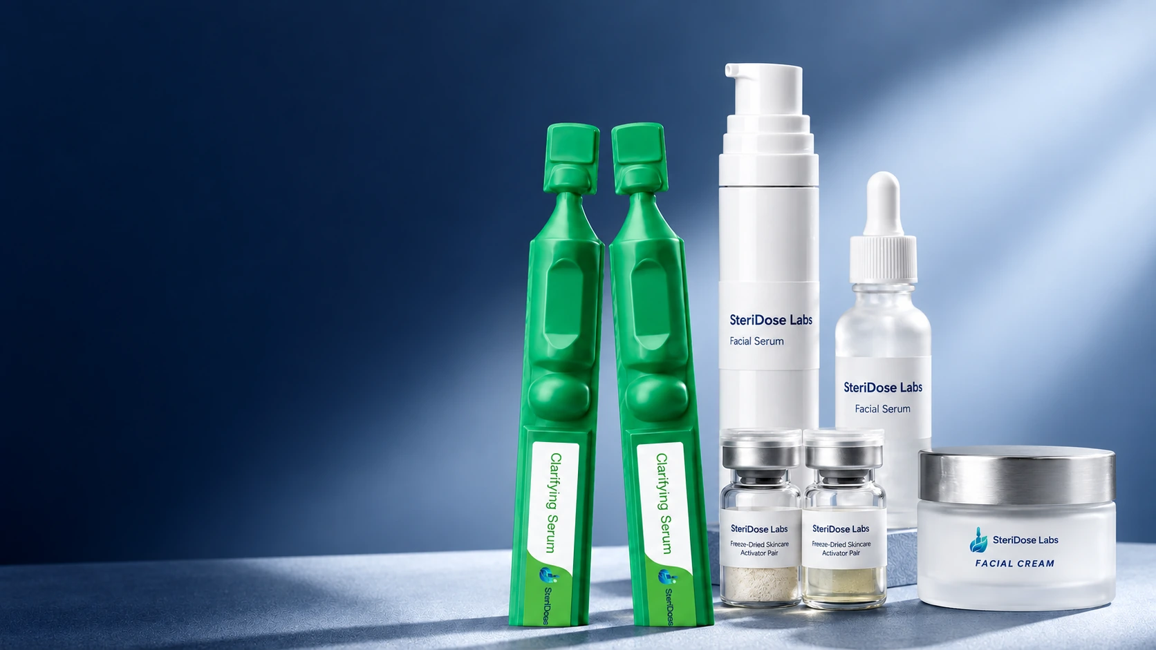 SteriDose BFS ampoules, freeze-dried vials, pump and dropper bottles, and a cream jar on a blue studio background